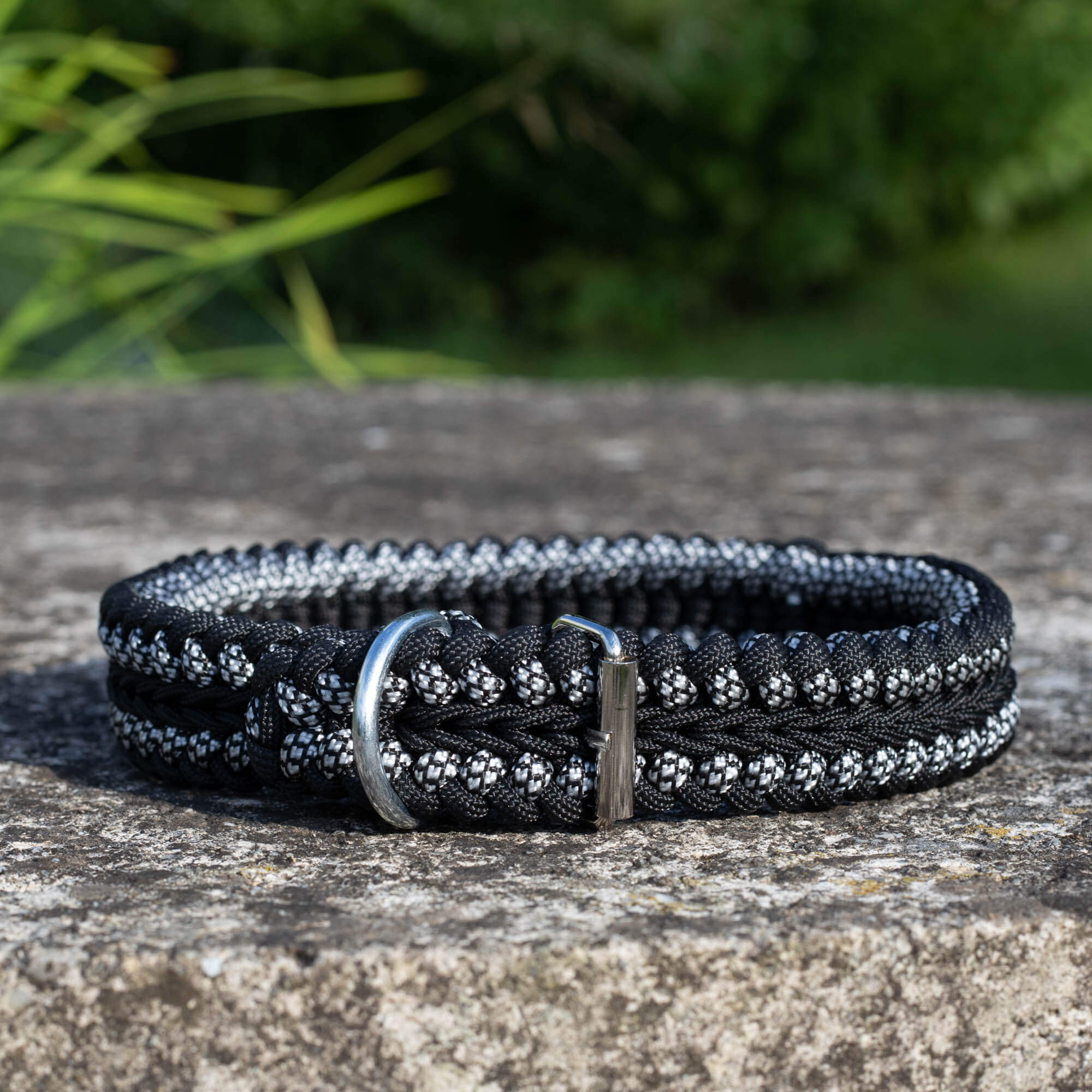 Adjustable black and white braided paracord dog leash.