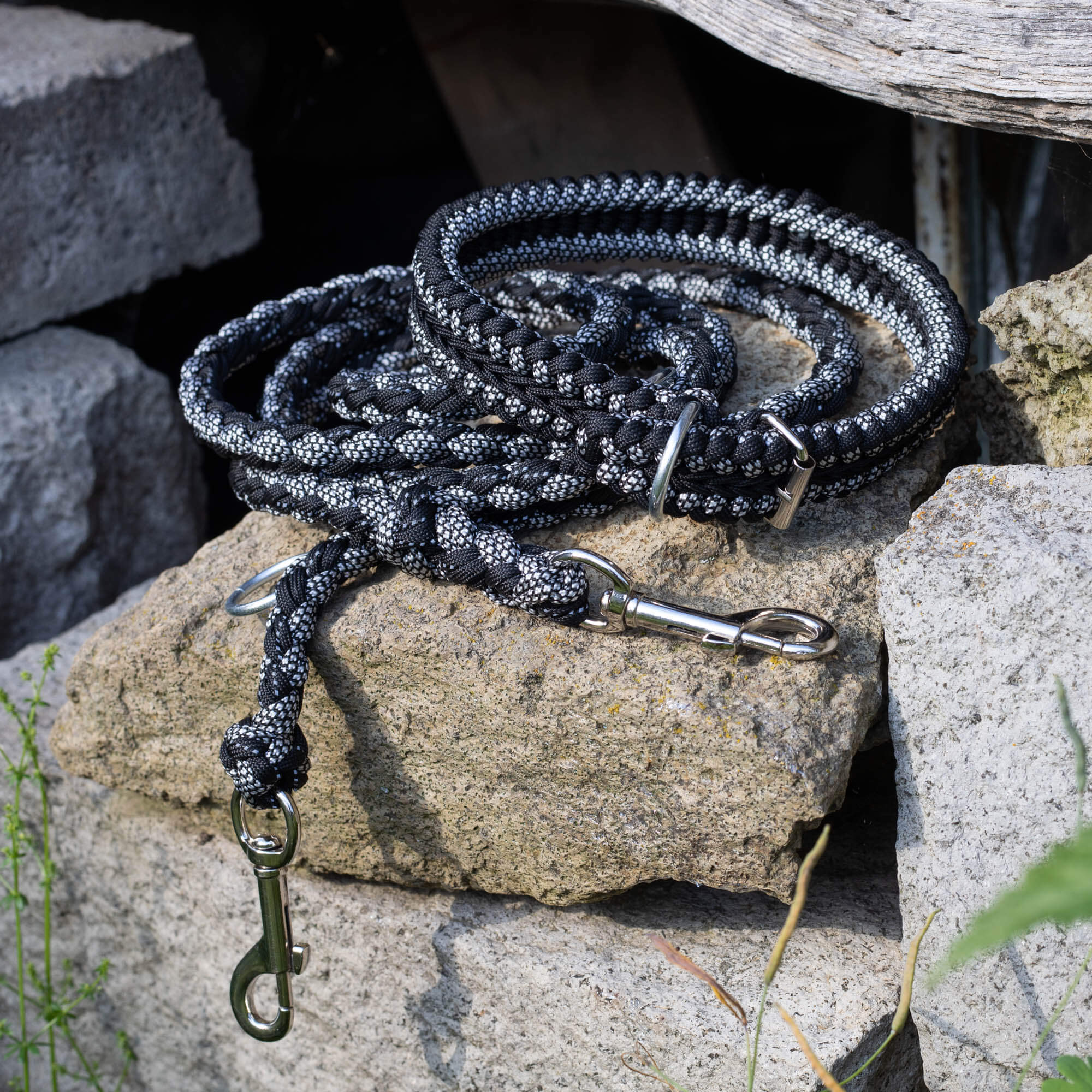 Round braid dog leash made of 8 strands of black and white paracord.