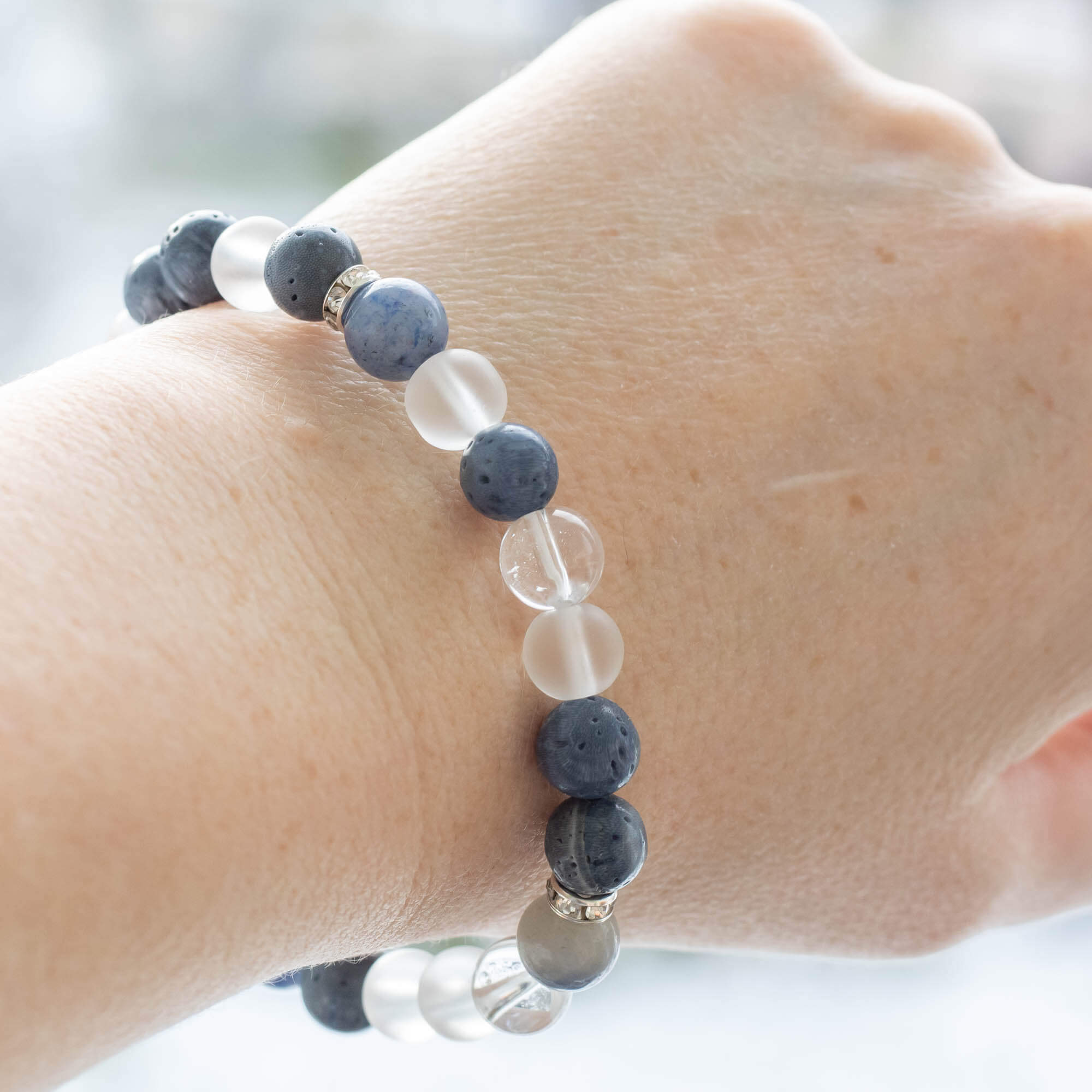 Blue gemstone bracelet made with Crystal Quartz, blue Aventurine and blue Coral beads. Bracelet is accented with rondelles.